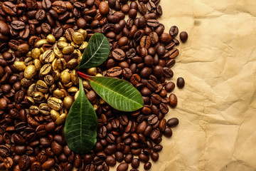 Golden and brown coffee grains on brown paper