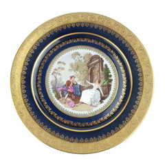 Antique golden plate with with image of people isolated on white background
