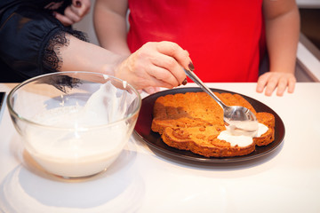 Dressing of carrot cake with sour cream sauce