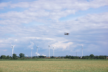 Windmills near the village. Windmills in the autumn field.