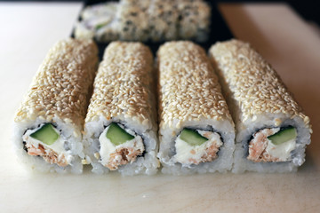Sushi roll with fried salmon