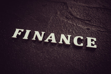 Finance concept. The finance word on black background