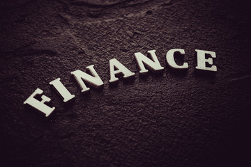 Fototapeta premium Finance concept. The finance word on black background