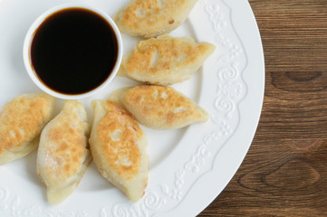 fried dumplings with soy sauce.