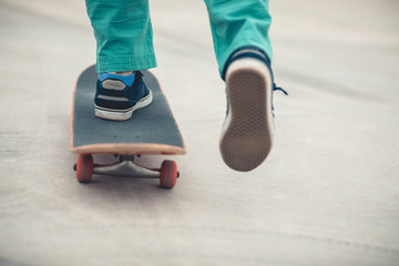 Skateboarder legs skateboarding at outdoors