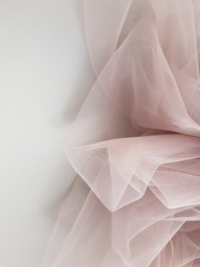Abstract folded soft blush pink tulle background, Tulle texture, Tulle close up