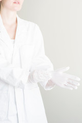 Doctor with white gloves