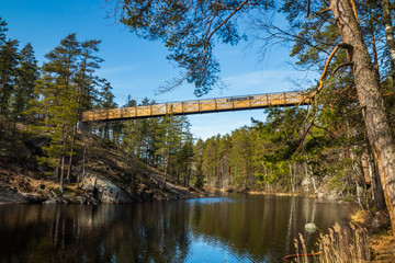 Fototapeta na wymiar New bridge over the lake Lapinsalmi in the National Park Repovesi, Finland