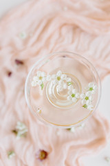 flowers in coupe champagne glass