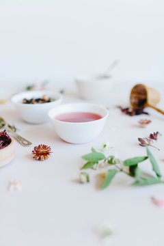 varieties of dry tea, herbal, green, black tea and fruit tea on antique silver teaspoons