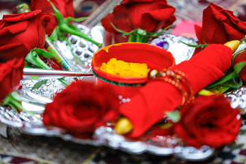 Obraz na płótnie Canvas Traditional wedding ceremony in Hinduism: Turmeric in plate for haldi ceremony