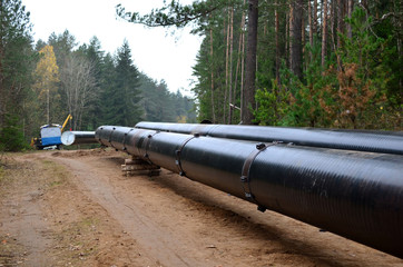 Sections of pipe on top of wooden supports at an construction site for natural gas. Construction...