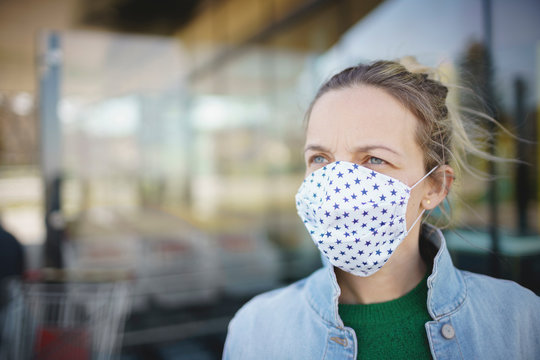 Portrait Of Young Beautiful Woman Wearing Mouth Face Mask During Covid 19 Or Corona Crisis