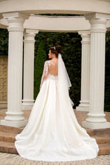 Fototapeta premium Beautiful woman posing in wedding dress