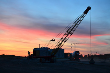 Crawler crane with a heavy metal wrecking ball on a steel cable. Wrecking balls at construction...