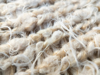 Close up on fluffy soft pale pink knit texture