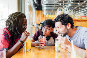 Group of friends drinking juice at the bar
