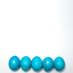 Many colored blue easter eggs isolated on the white background.