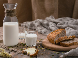 Rustic breakfast with milk and bread. World Milk Day on the first of June. Horizontal shot.