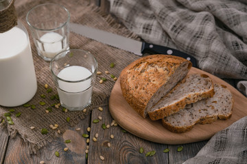 Rustic breakfast with milk and bread on World Milk Day, first of June. Horizontal shot from above.