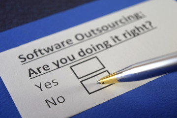 Obraz premium One person is answering question about software outsourcing.