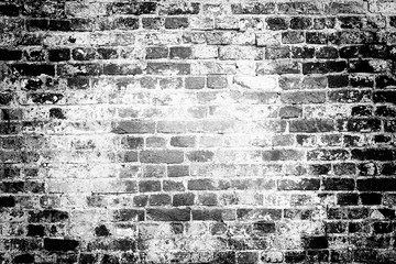 Black and white brick wall. Vintage brick wall texture background with vignette. 