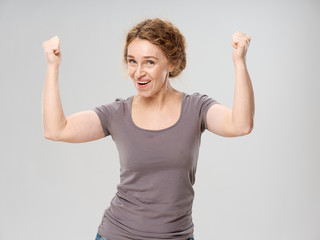 happy young woman showing victory sign