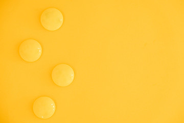 Yellow balls on yellow background. Minimal concept. Top view. Copy, empty space for text