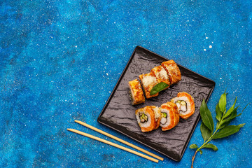 Grilled tiger prawn sushi. Japanese or Korean roll with different fresh ingredients. Nautical background