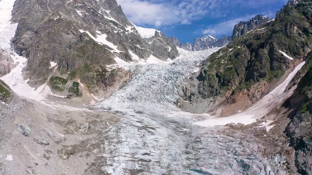 Caucasus Mountains on the border of Russia and Georgia. Chalaat Pass and Very beautiful view of the Chalaadi Glacier, Mount Ushba and Mestiachala river with background of clear blue sky.