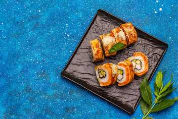 Grilled tiger prawn sushi. Japanese or Korean roll with different fresh ingredients. Nautical background
