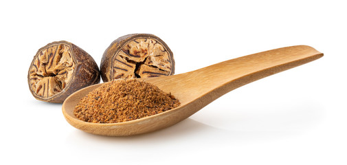Nutmeg powder in wood spoon on white background