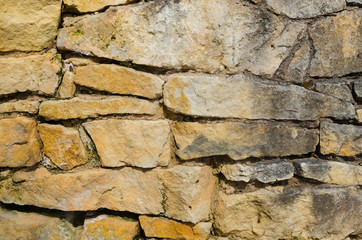 Texture of a stone wall, an ancient fortress, and a cave
