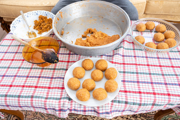 Traditional Turkish Food; Stuffed Meatballs,  Turkish known as "icli kofte". Woman making Stuffed Meatballs at home.