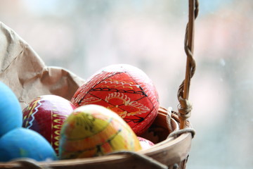 Basket with easter eggs. Spring easter background with space for text.