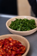 Food preparation with chillis, coriander and red onion