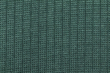 Green Synthetic fabric texture, background. Green fabric. Green background.