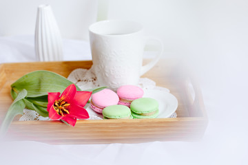 romantic morning greeting card.a Cup of morning tea with macaroons and a flower