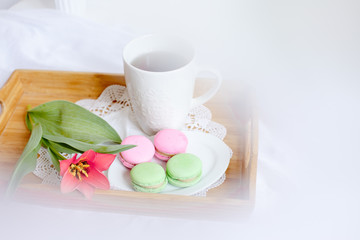 romantic morning greeting card.a Cup of morning tea with macaroons and a flower