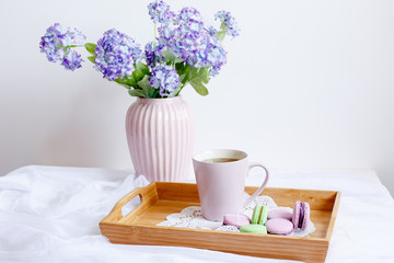 romantic morning greeting card.a Cup of morning tea with macaroons and a flower