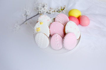 Easter morning greeting card. Easter gingerbread with spring blooming twig