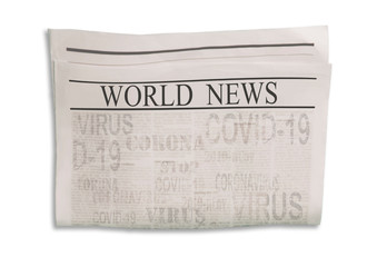 Coronavirus Covid-19 news. Newspaper with headlines on horizontal surface.