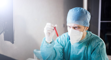 medical researcher in test tubes, saliva and blood tests. Scientific activity experiment
