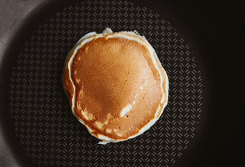 one delicious pancake is cooked in a pan