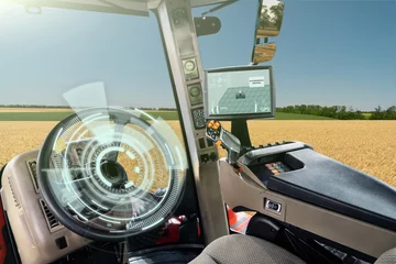 Schilderijen op glas Autonomous tractor working on the field. Smart farming  © scharfsinn86