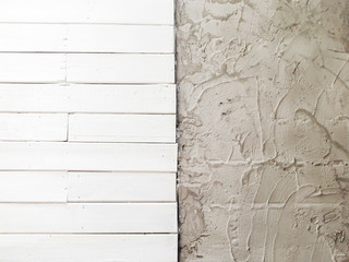 White wooden and raw concrete wall.