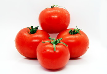 ripe tomatoes on a white background