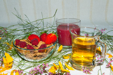 Breakfast with flakes, berries and strawberry juice