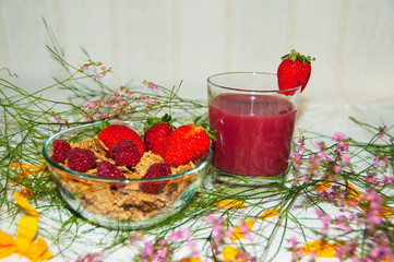 Breakfast with flakes, berries and strawberry juice
