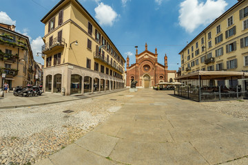 MILAN, ITALY - AUGUST 01, 2019: Santa Maria del Carmine Church. Tourists and locals walk in the...